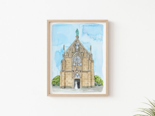 A framed hand painted custom watercolor wedding venue portrait of church with a couple walking in the doors.